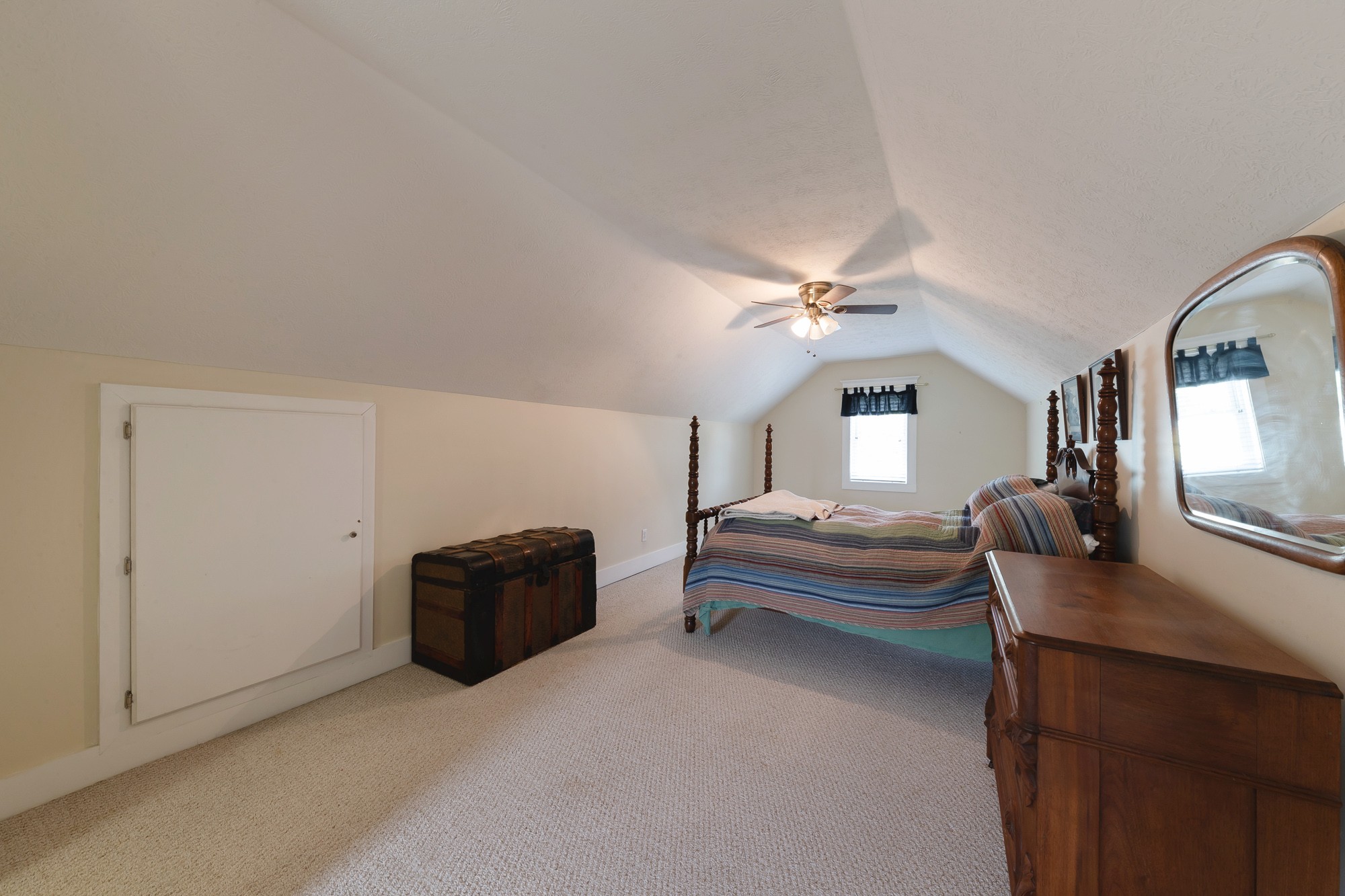 2446 Warner Bridge Road Shelbyville, TN 37160 - Photo 21 of 42 a bedroom with a bed and a chandelier