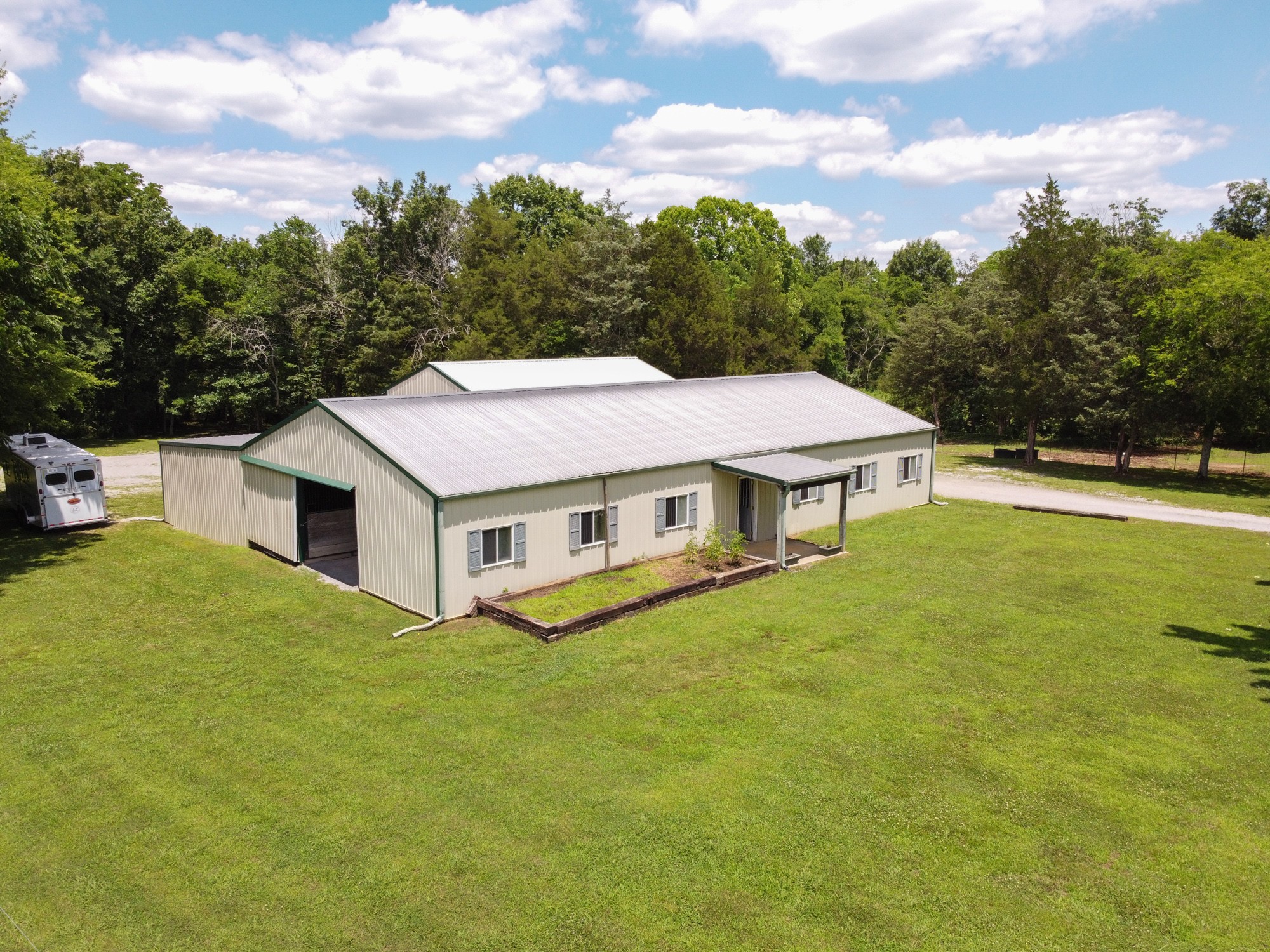 2446 Warner Bridge Road Shelbyville, TN 37160 - Photo 25 of 42 a aerial view of a house with swimming pool and a yard