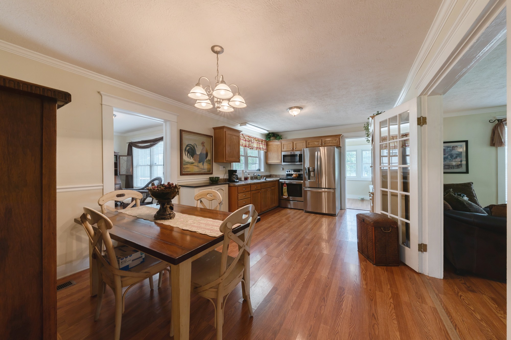 2446 Warner Bridge Road Shelbyville, TN 37160 - Photo 7 of 42 a view of a dining room and livingroom with furniture wooden floor a chandelier