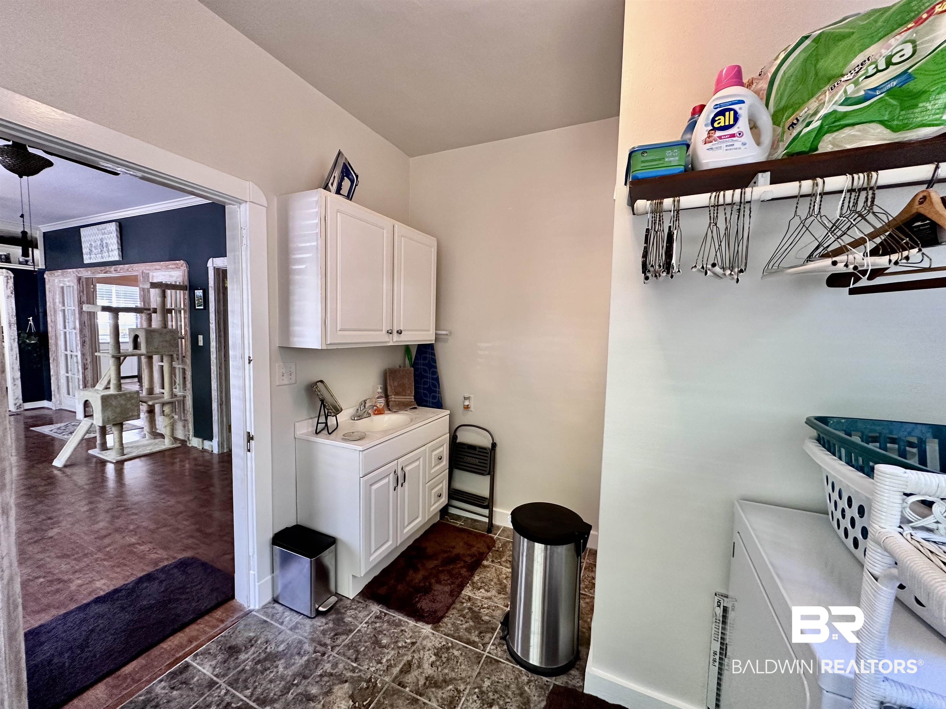 260 Siena Vista Street Mobile, AL 36607 - Photo 23 of 41 Laundry room with baseboards and a sink