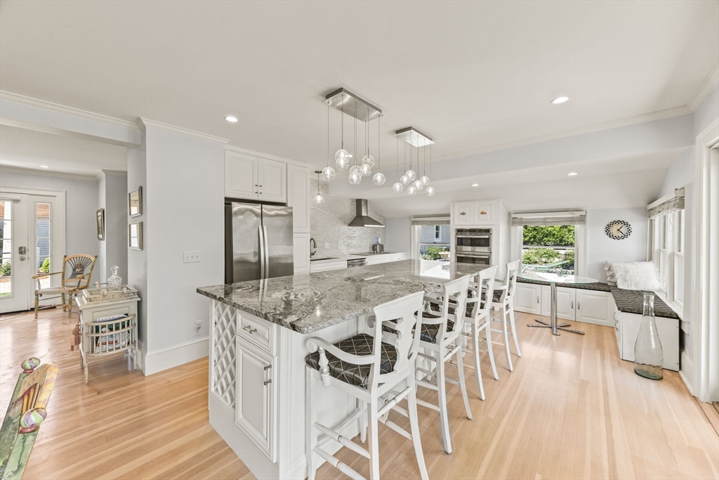 88 Bridge Street Barnstable, MA 02655 - Photo 11 of 36 a view of a dining hall with furniture and wooden floor