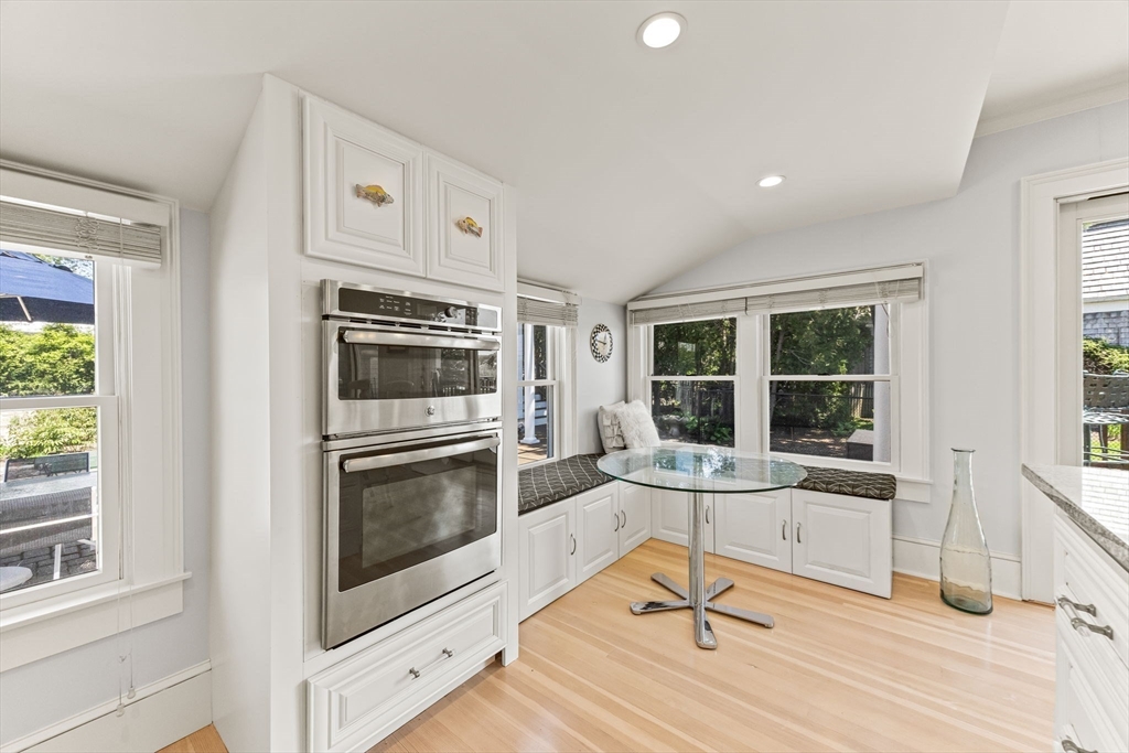 88 Bridge Street Barnstable, MA 02655 - Photo 13 of 36 a living room with granite countertop cabinets and a stove top oven