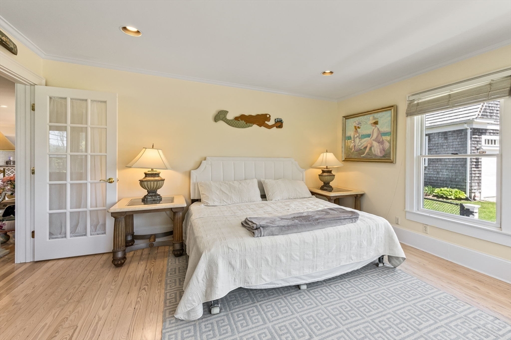 88 Bridge Street Barnstable, MA 02655 - Photo 21 of 36 a bedroom with a bed and wooden floor