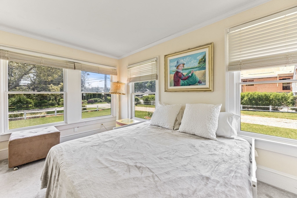 88 Bridge Street Barnstable, MA 02655 - Photo 23 of 36 a large bed sitting in a bedroom next to a window