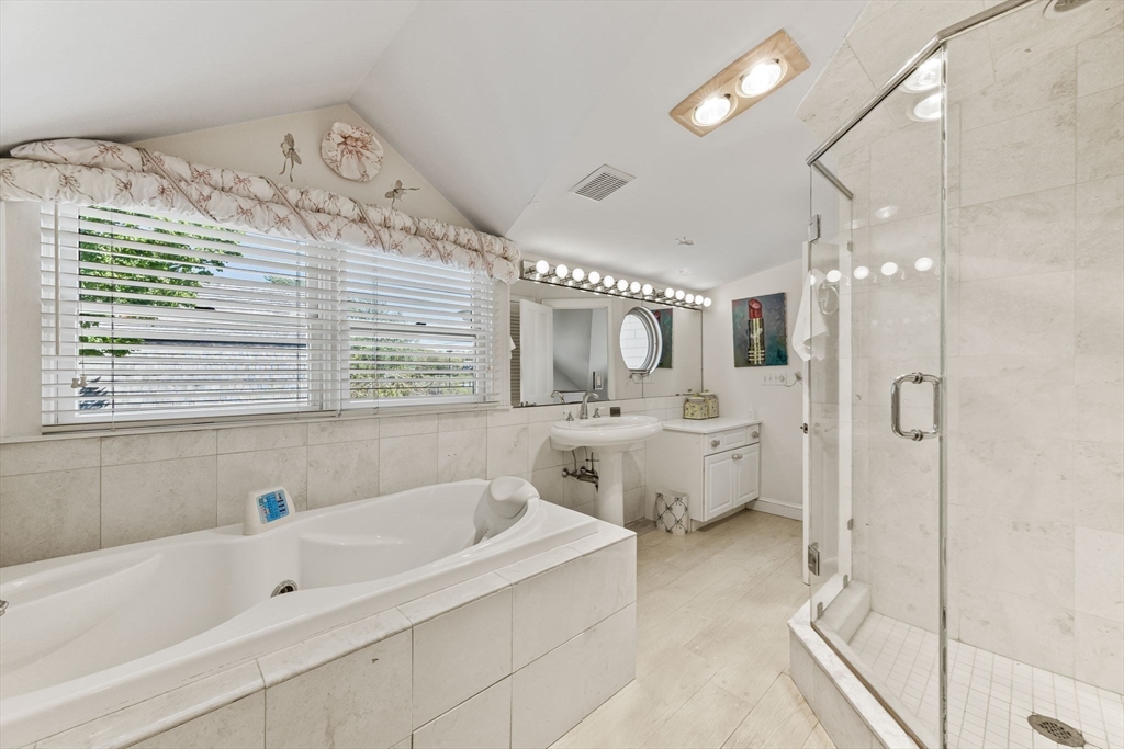 88 Bridge Street Barnstable, MA 02655 - Photo 27 of 36 a bathroom with a bathtub and a shower