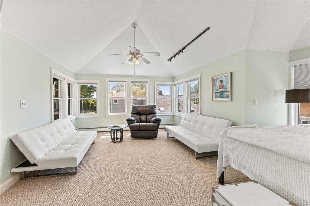 88 Bridge Street Barnstable, MA 02655 - Photo 29 of 36 a living room with furniture and a chandelier