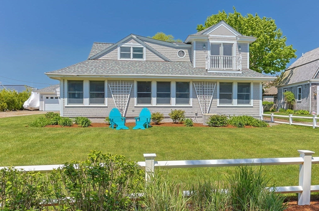 88 Bridge Street Barnstable, MA 02655 - Photo 3 of 36 a front view of a house with a yard