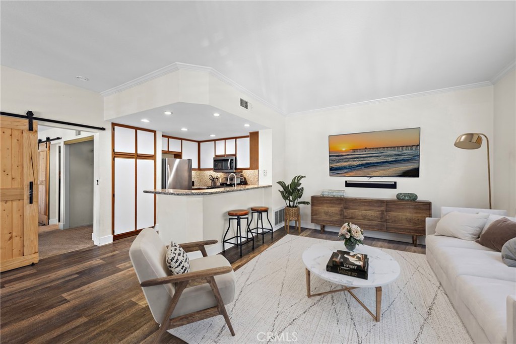 55 Rabano, Unit 240 Rancho Santa Margarita, CA 92688 - Photo 1 of 1 Furnishings in family and dining rooms have been virtually staged