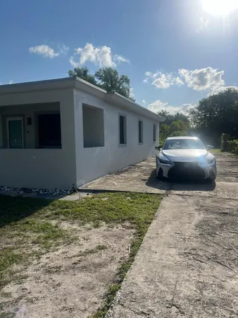 a house view with a backyard space