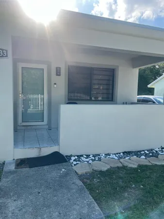 a view of an empty room with windows