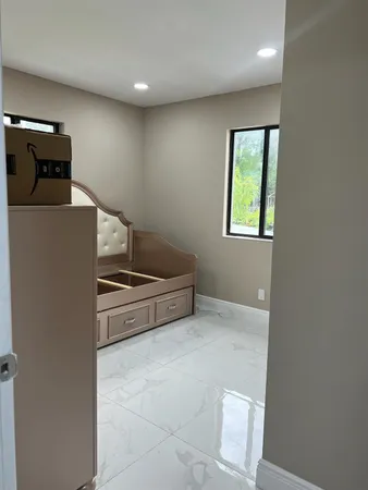 a kitchen with stainless steel appliances a refrigerator and a stove