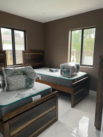 a living room with furniture and windows