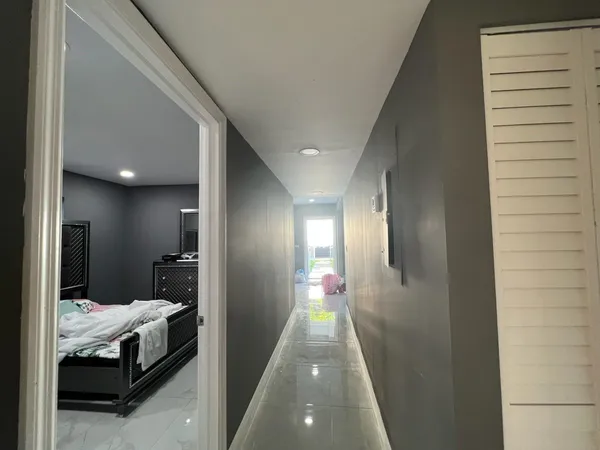 a en suite bathroom with a double vanity sink and a mirror