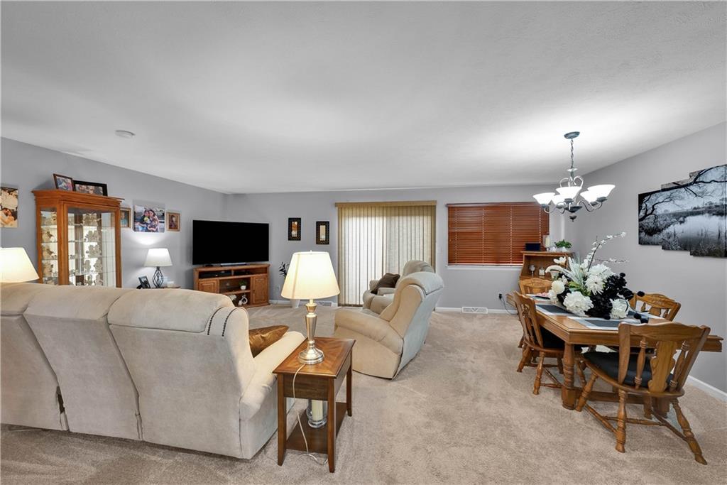 306 Acre Avenue Butler, PA 16001 - Photo 11 of 29 a living room with furniture a flat screen tv and a window