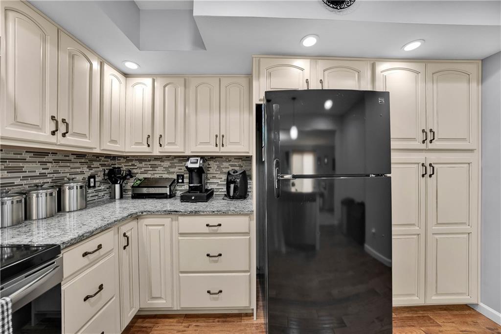306 Acre Avenue Butler, PA 16001 - Photo 16 of 29 a kitchen with white cabinets and refrigerator