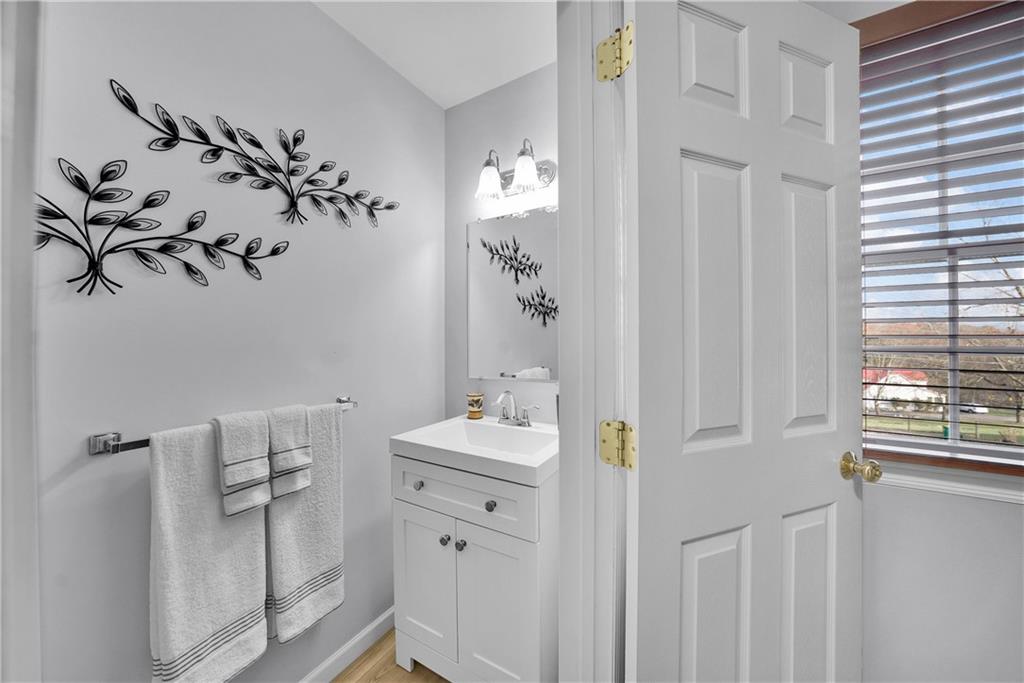 306 Acre Avenue Butler, PA 16001 - Photo 18 of 29 a bathroom with a sink and mirror with toilet