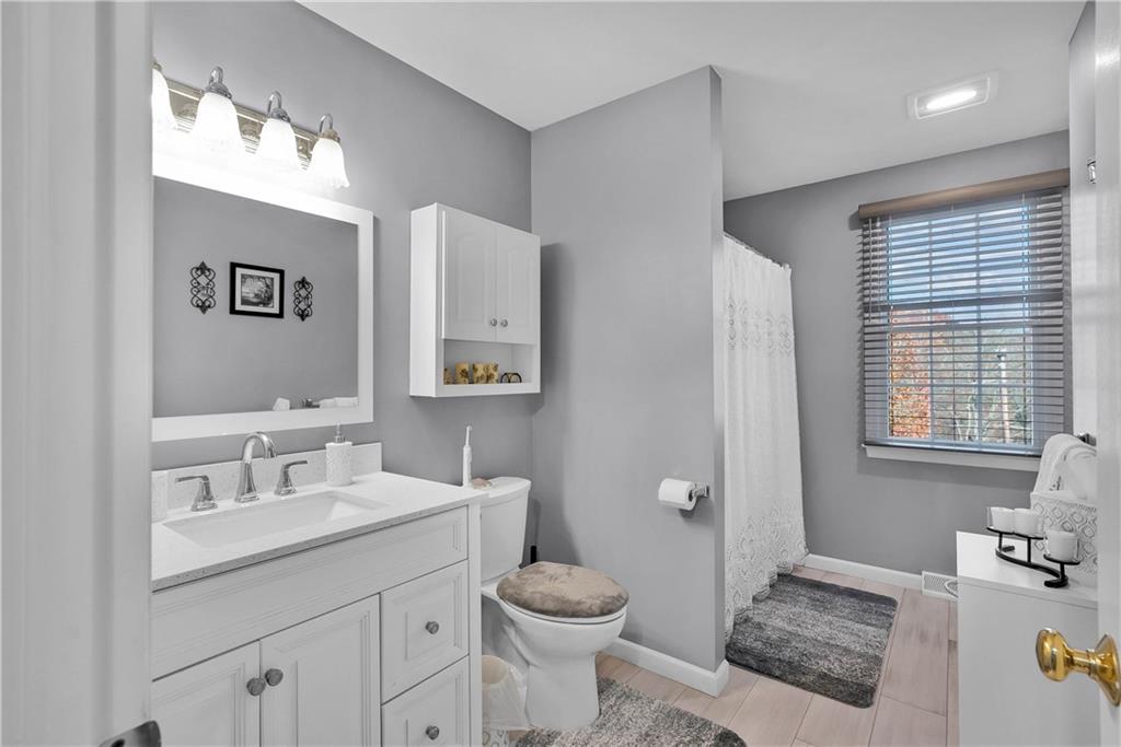 306 Acre Avenue Butler, PA 16001 - Photo 19 of 29 a bathroom with a sink toilet and window