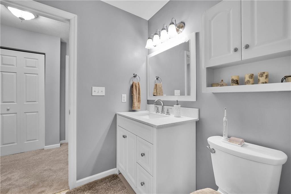 306 Acre Avenue Butler, PA 16001 - Photo 20 of 29 a bathroom with a toilet sink and mirror