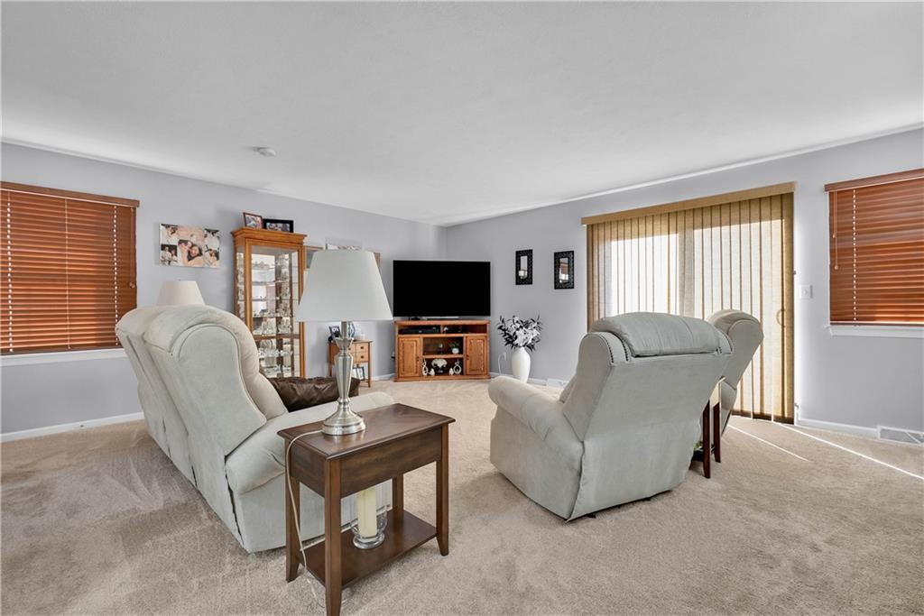306 Acre Avenue Butler, PA 16001 - Photo 6 of 29 a living room with furniture and a flat screen tv