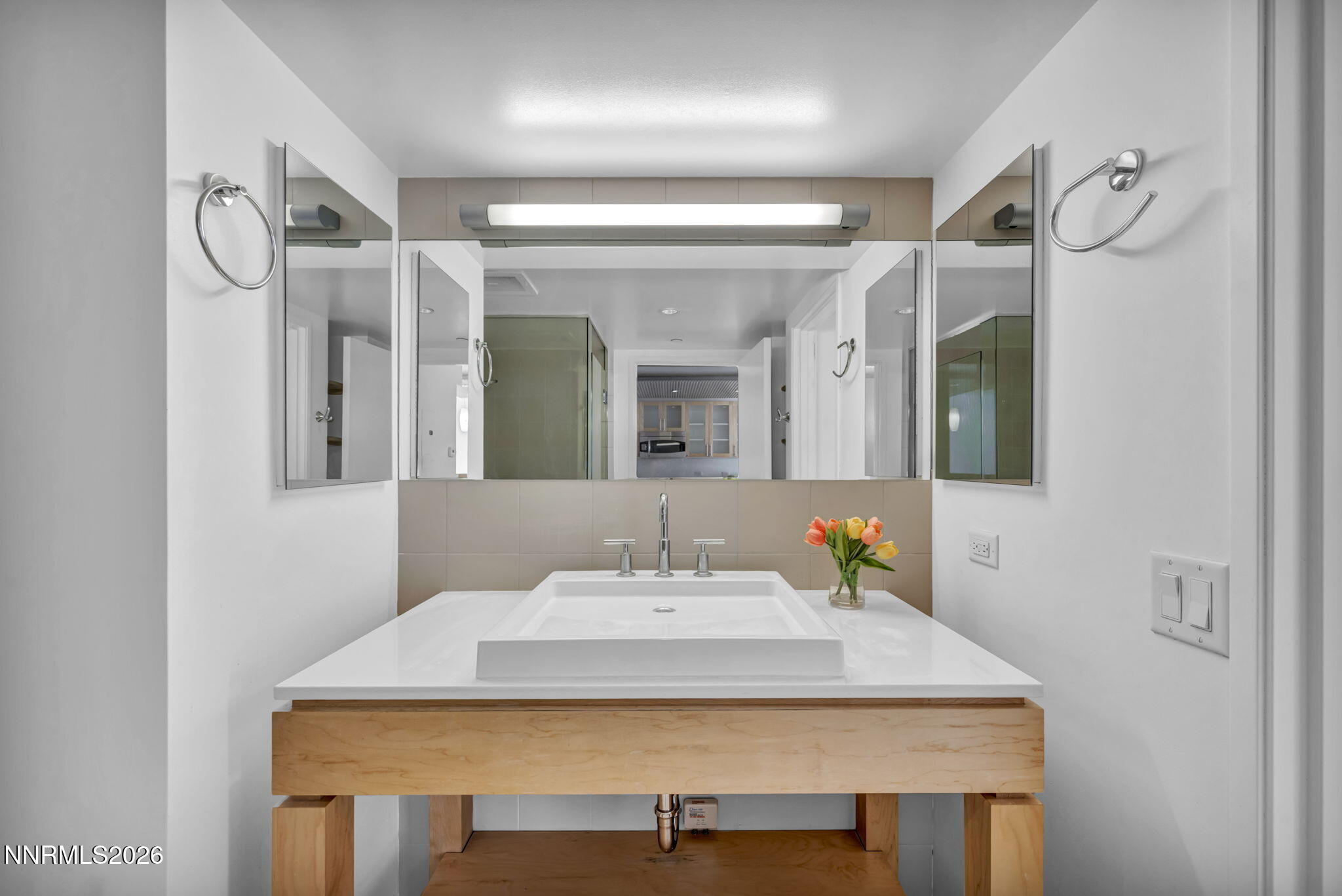 255 North Sierra Street, Unit 1208 Reno, NV 89501 - Photo 23 of 37 a bathroom with a sink vanity and a mirror