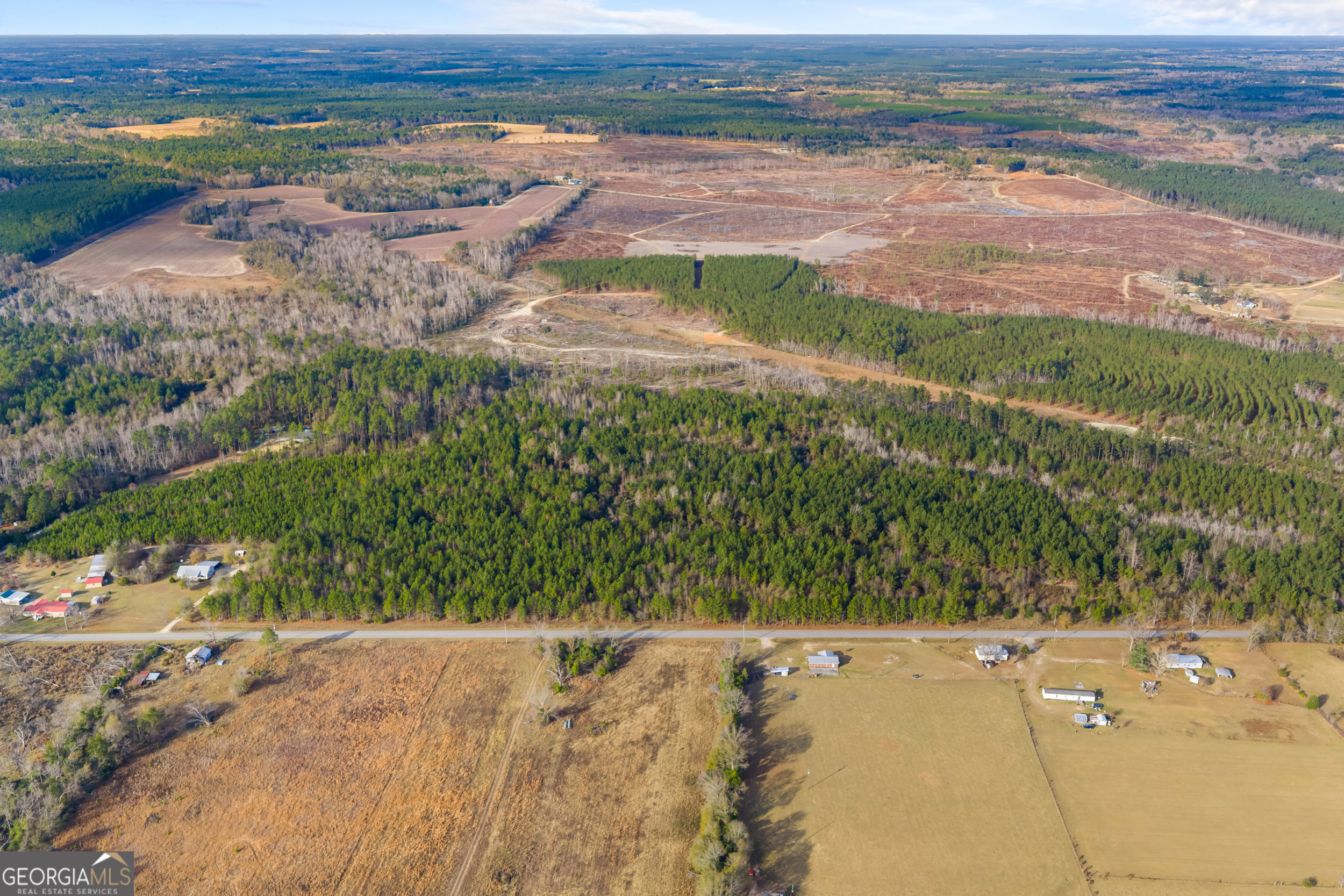 an aerial view of residential houses with outdoor space