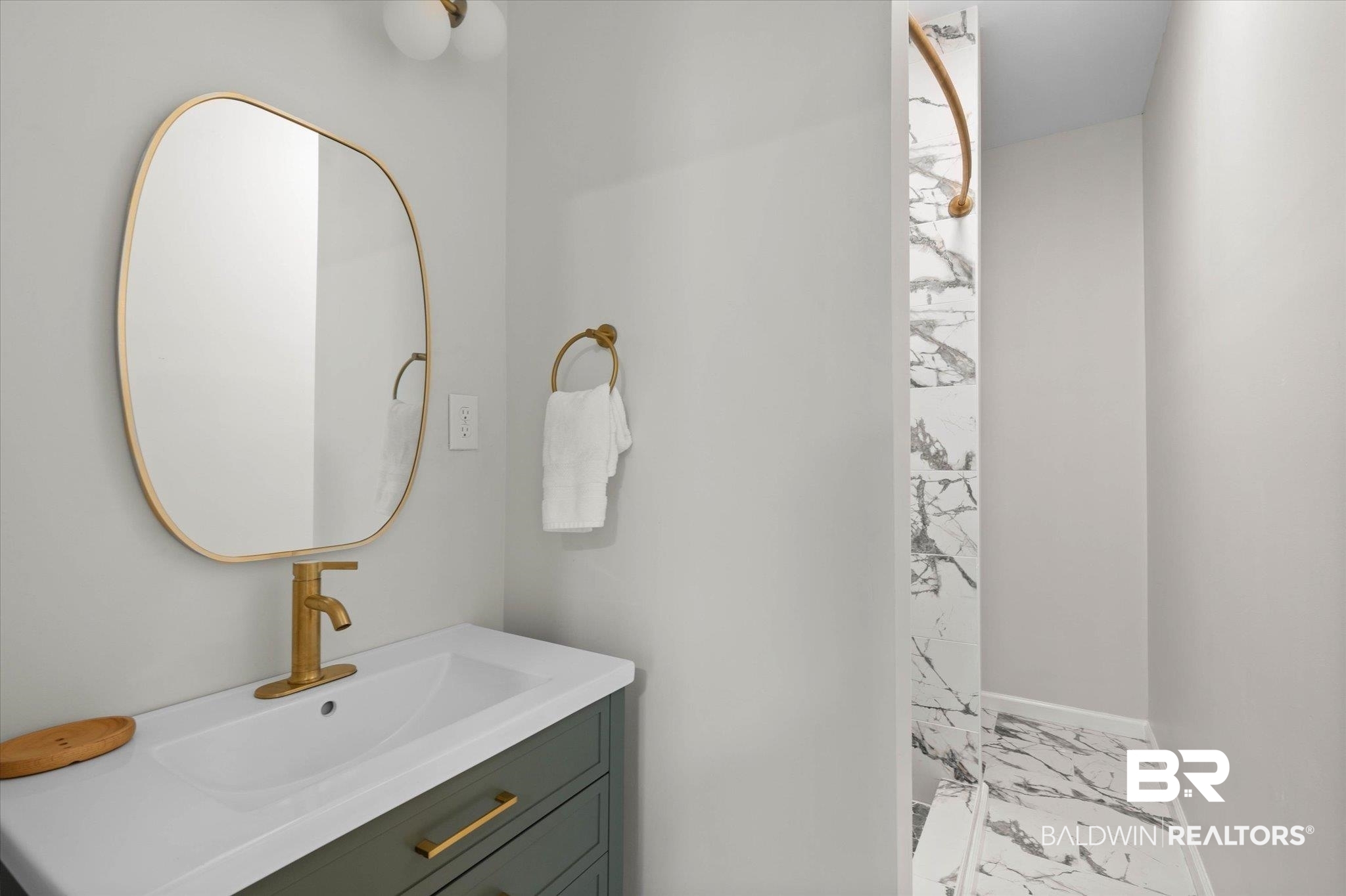3512 Spring Hill Avenue Mobile, AL 36608 - Photo 12 of 20 Bathroom featuring marble look tile flooring, vanity, and a shower