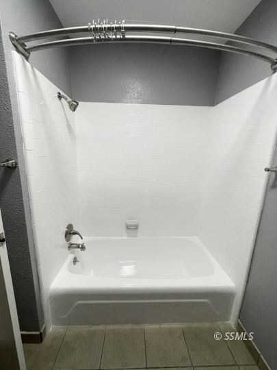 656 West Felspar Avenue Ridgecrest, CA 93555 - Photo 21 of 45 a close up of a bathtub in a bathroom