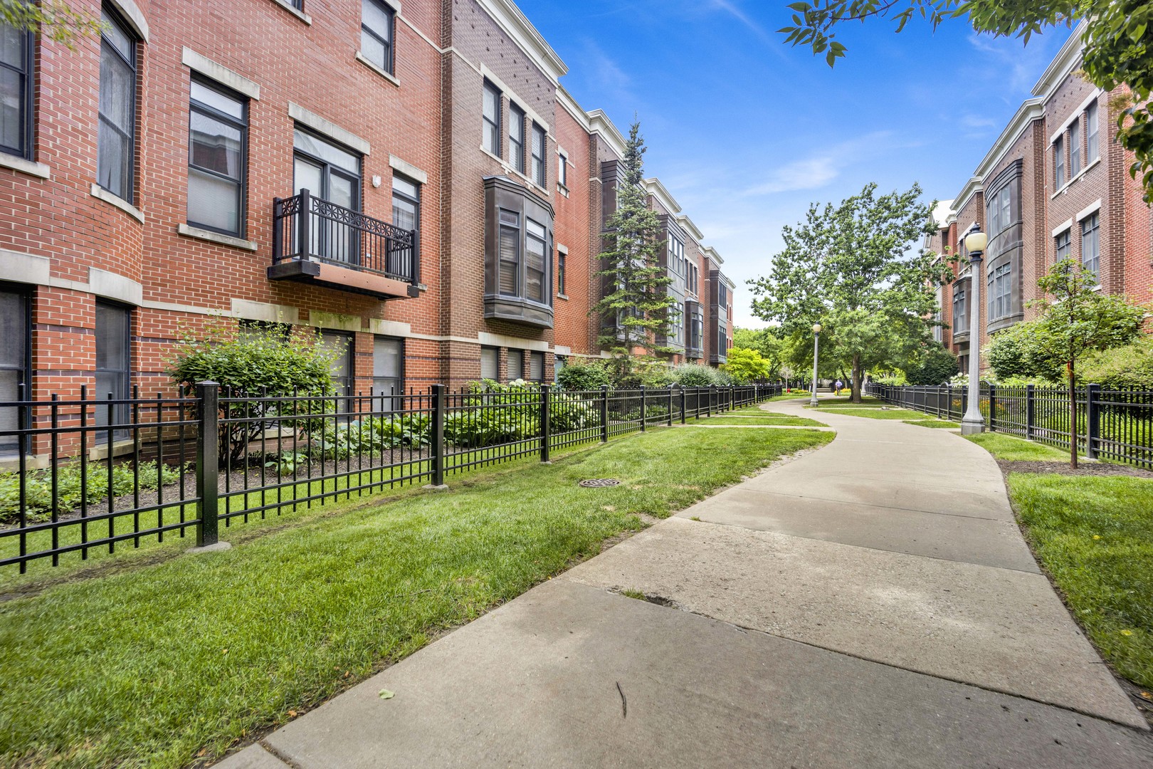 1414 South Halsted Street, Unit 3A Chicago, IL 60607 - Photo 25 of 62 a view of a building with a yard