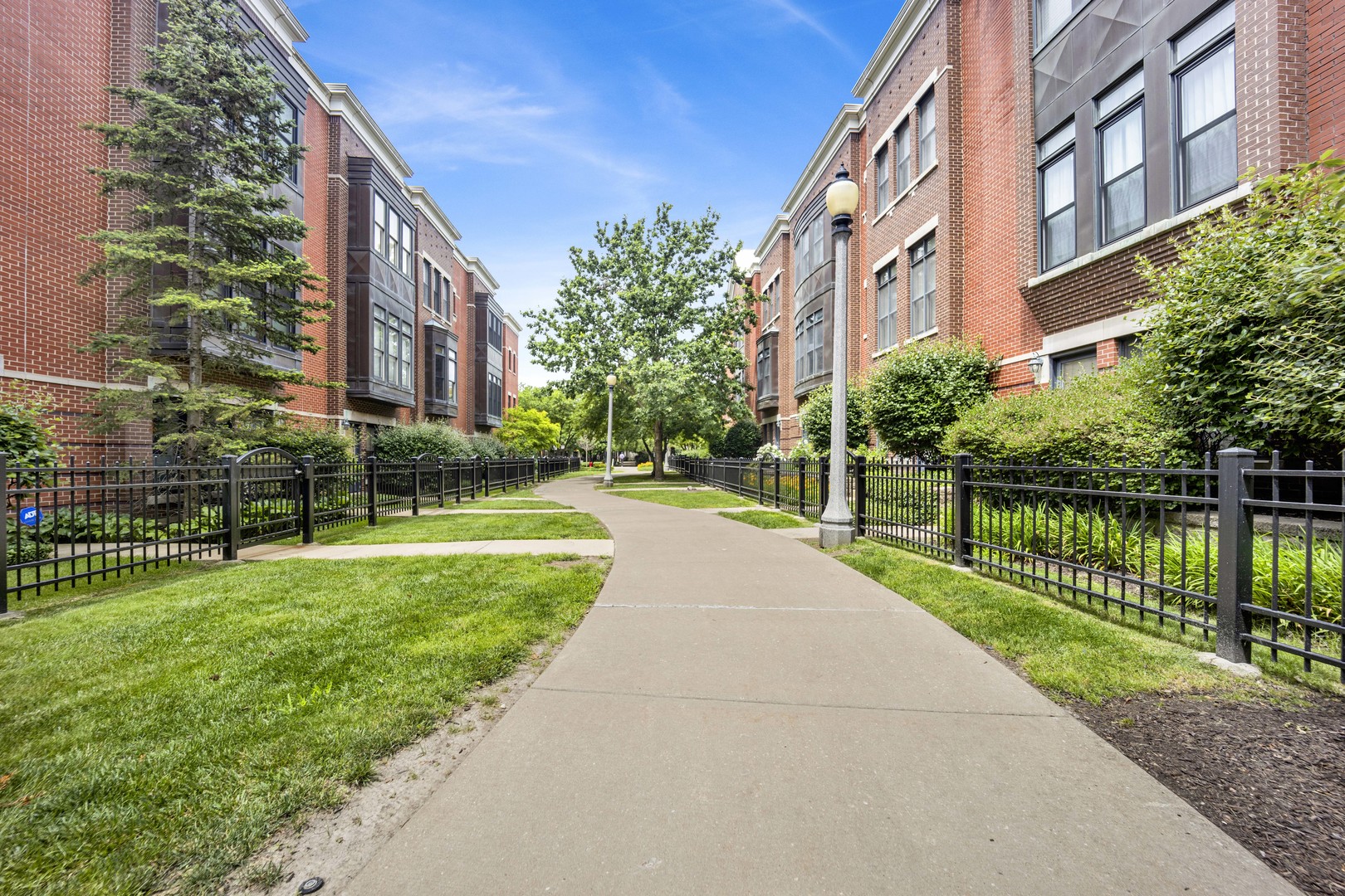 1414 South Halsted Street, Unit 3A Chicago, IL 60607 - Photo 26 of 62 a view of a building with a yard