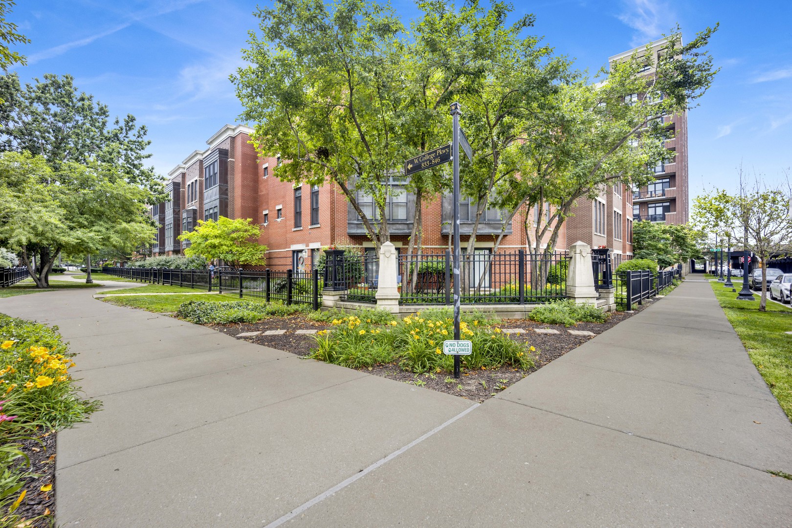 1414 South Halsted Street, Unit 3A Chicago, IL 60607 - Photo 28 of 62 a front view of a building with a garden and trees