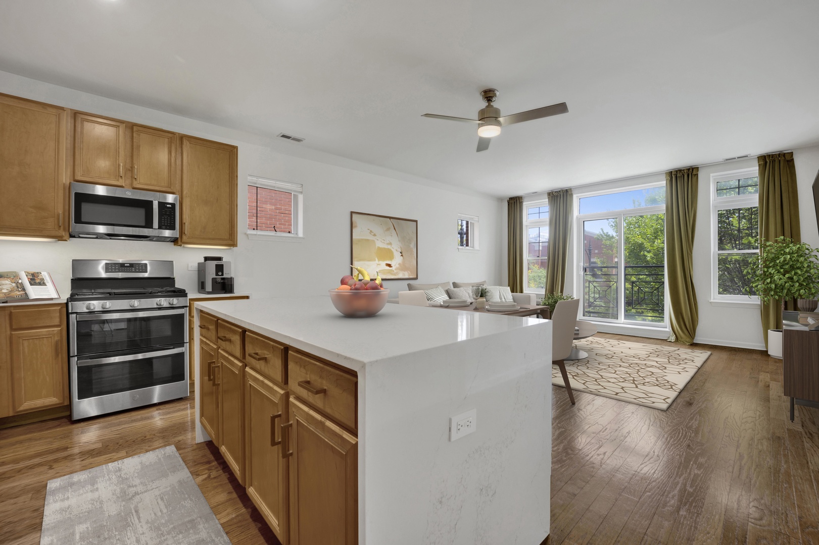1414 South Halsted Street, Unit 3A Chicago, IL 60607 - Photo 4 of 62 a kitchen with kitchen island a stove a sink and a refrigerator