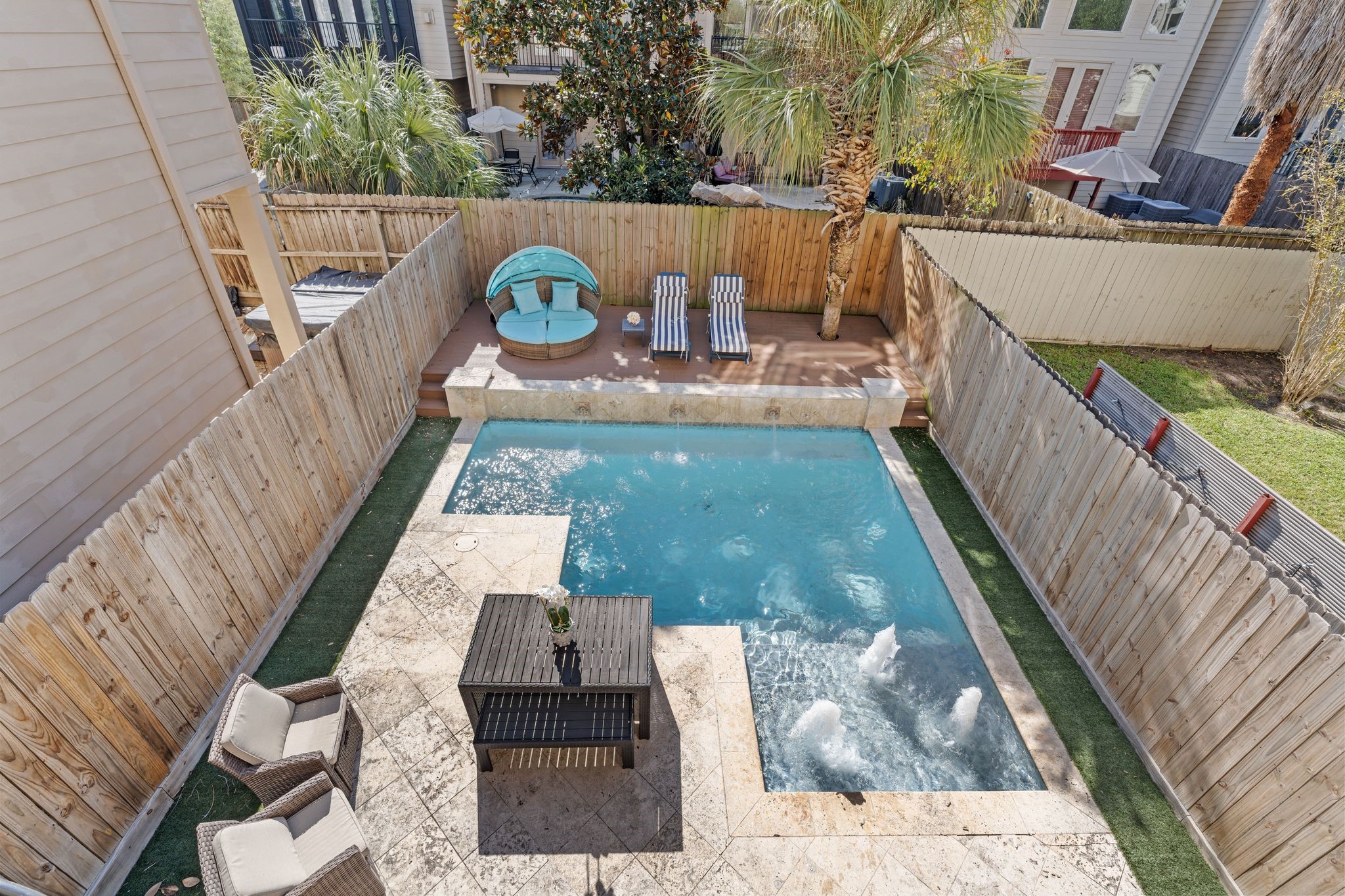 5203 Lillian Street Houston, TX 77007 - Photo 15 of 36 Enjoy the view from your second-floor balcony, with a spiral staircase that leads directly down to the patio for effortless indoor-outdoor flow.