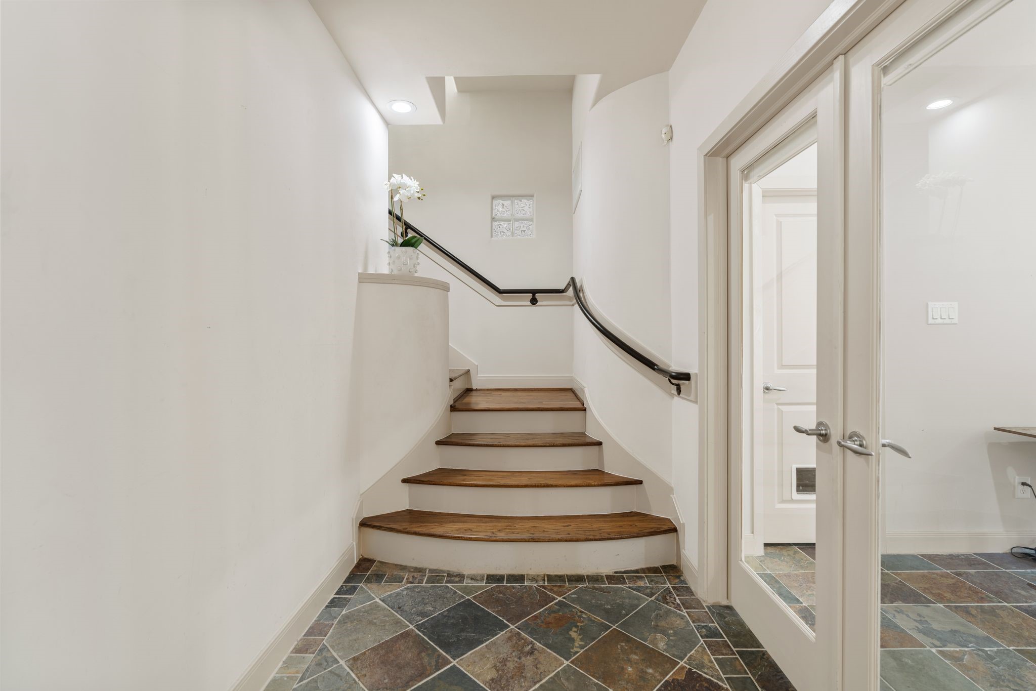 5203 Lillian Street Houston, TX 77007 - Photo 4 of 36 Gated entry leads you to your front door and foyer. Behind the french doors fine your first floor en suite bedroom with walk in closet and french doors that lead to your beautiful backyard.