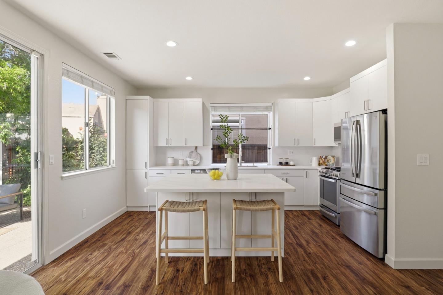 34237 Tupelo Street Fremont, CA 94555 - Photo 13 of 33 a kitchen with refrigerator cabinets and wooden floor