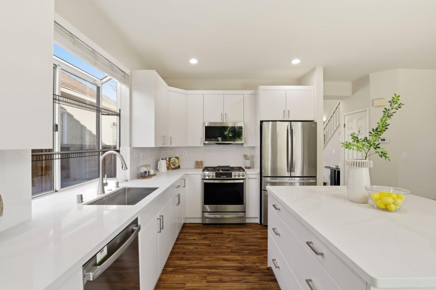 34237 Tupelo Street Fremont, CA 94555 - Photo 15 of 33 a kitchen with a sink a counter top space stainless steel appliances and cabinets
