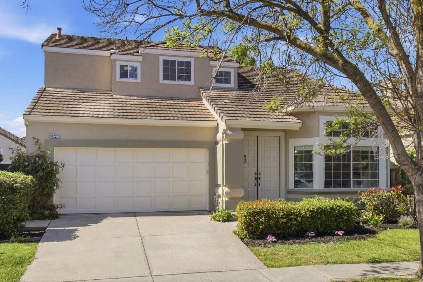 34237 Tupelo Street Fremont, CA 94555 - Photo 2 of 33 a view of a house with a yard and plants