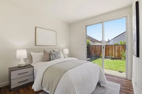 a bed room with a bed and a view of bedroom