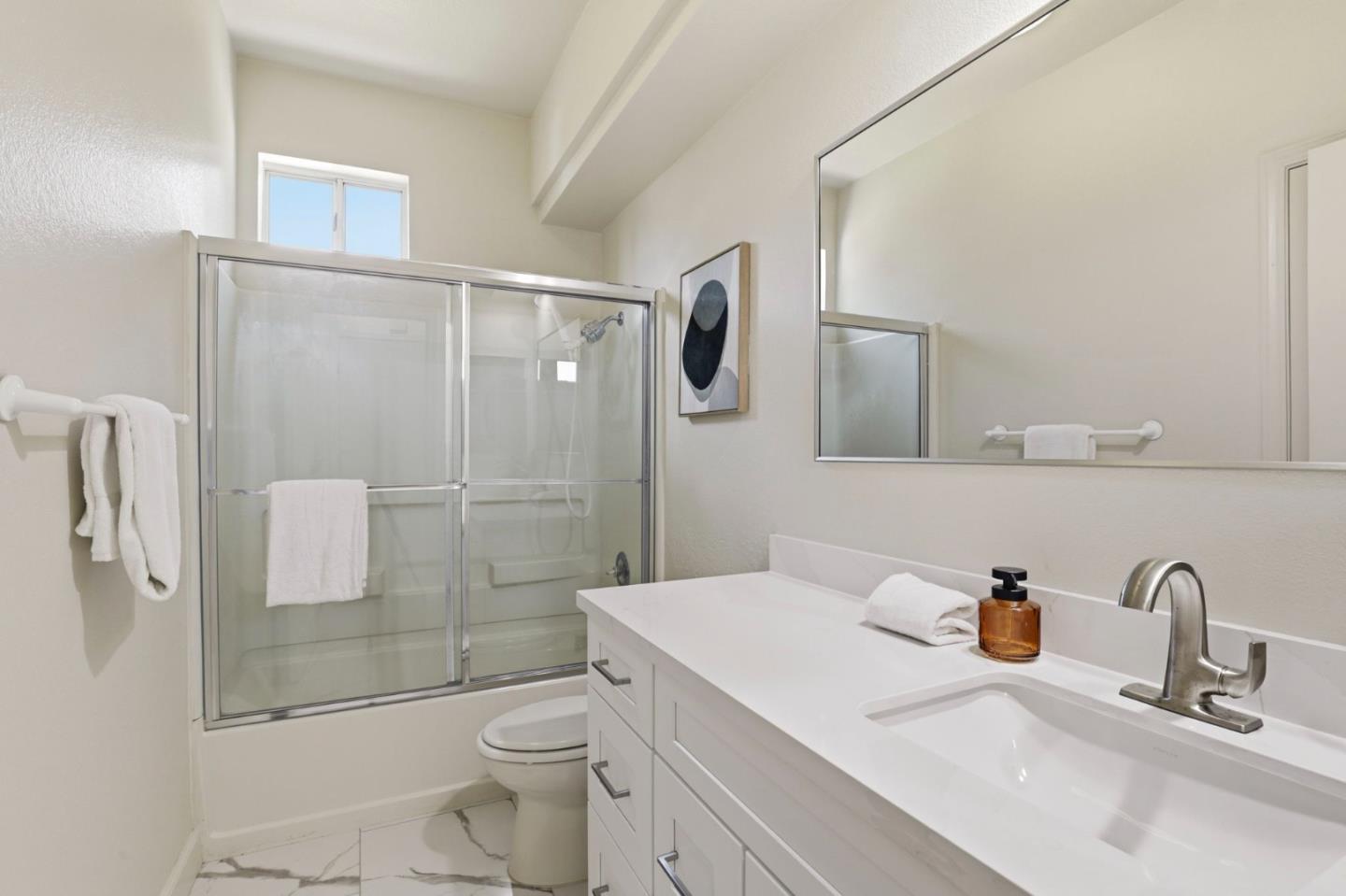 34237 Tupelo Street Fremont, CA 94555 - Photo 22 of 33 a bathroom with a sink toilet and shower