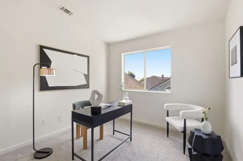 a view of a workspace with furniture