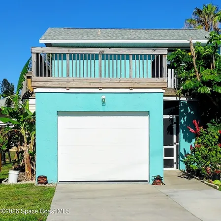 a view of a house with a yard and plants