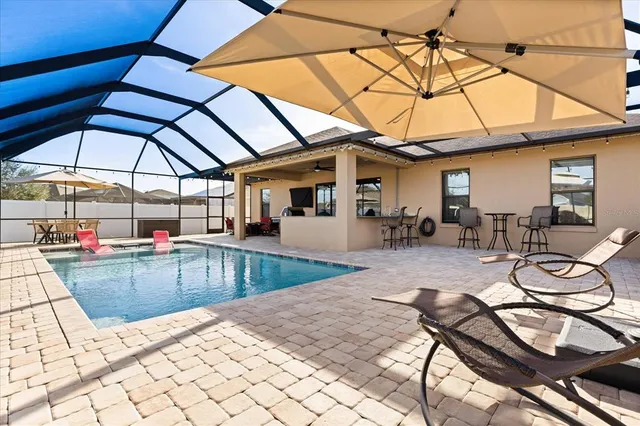 a view of a swimming pool with a patio