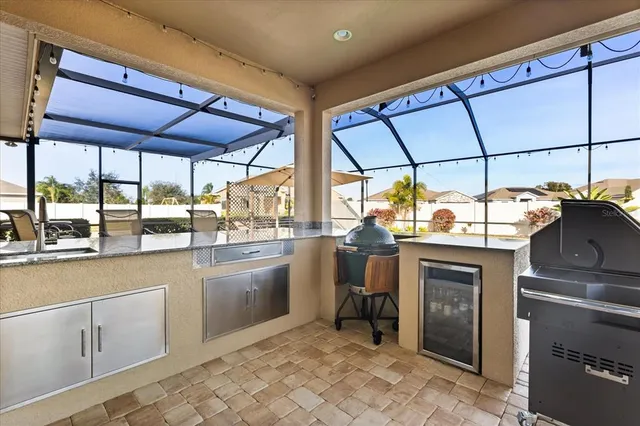 a kitchen with sink cabinets and outdoor view