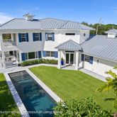 a aerial view of a house with swimming pool