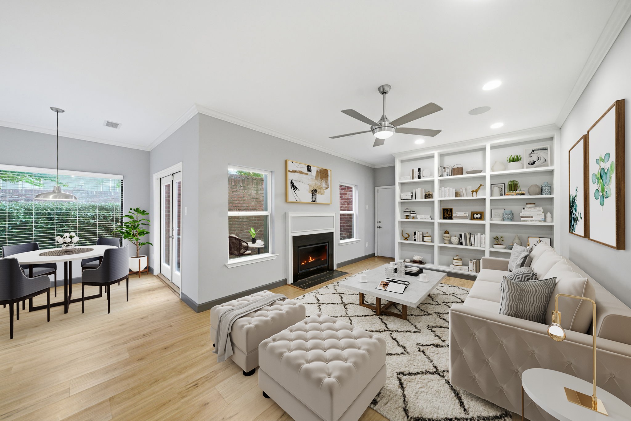 a living room with furniture a fireplace and a large window