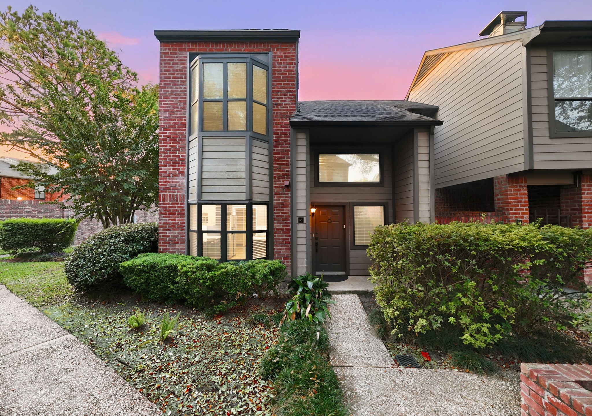 7447 Cambridge Street, Unit 65 Houston, TX 77054 - Photo 2 of 42 a front view of a house
