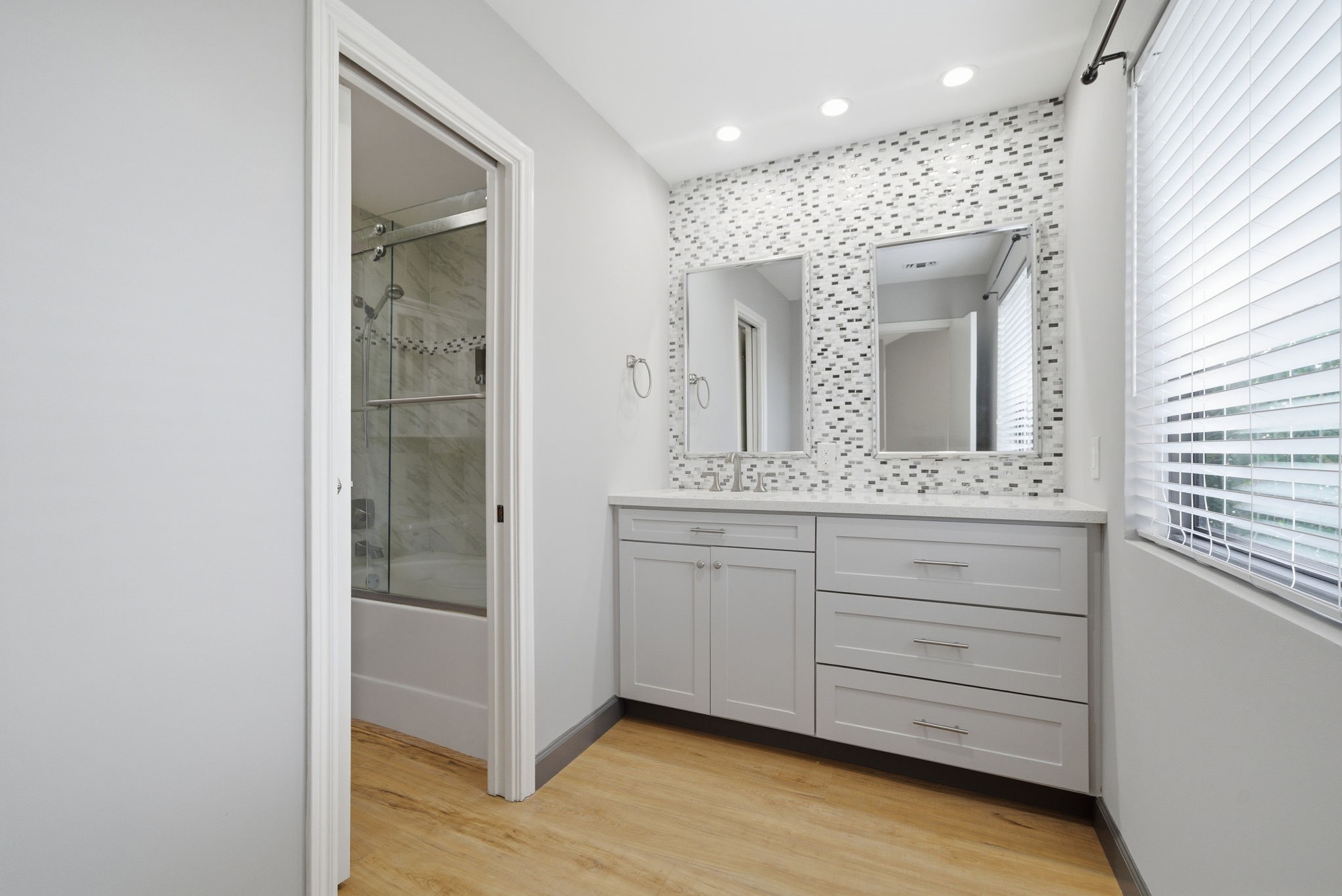 7447 Cambridge Street, Unit 65 Houston, TX 77054 - Photo 6 of 42 a bathroom with a sink and a mirror
