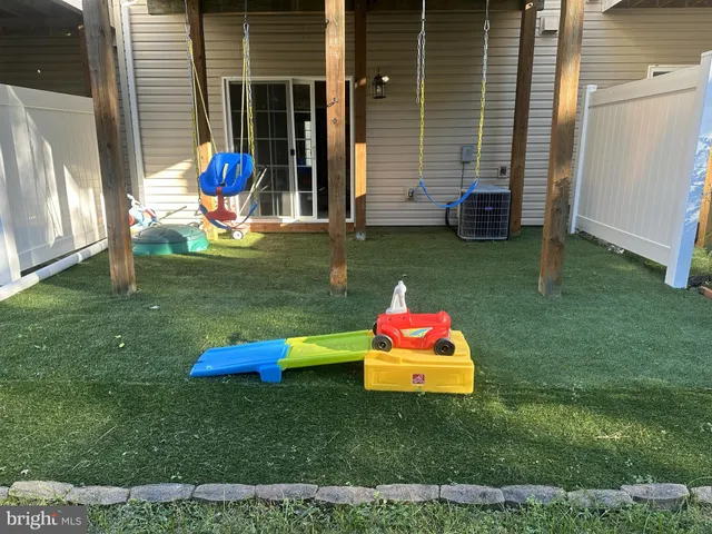 a backyard of a house with seating space