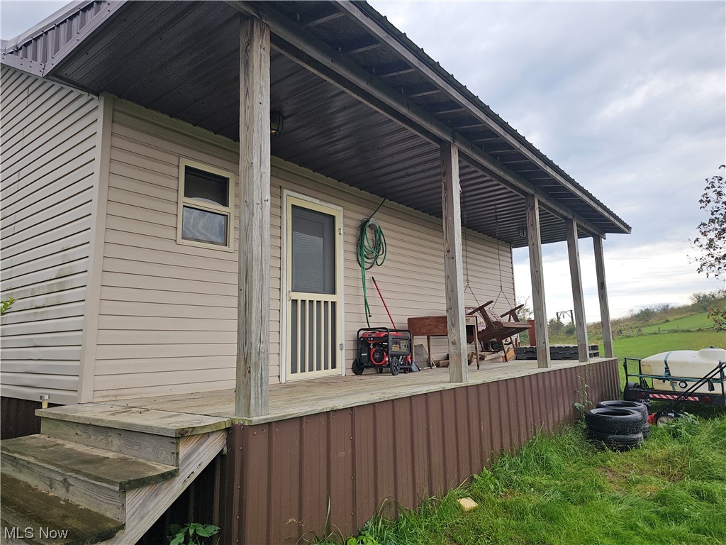 436 Davidson Ridge Road Palestine, WV 26160 - Photo 3 of 27 View of back covered porch