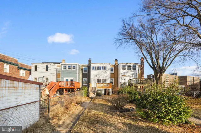 a view of a building with a yard