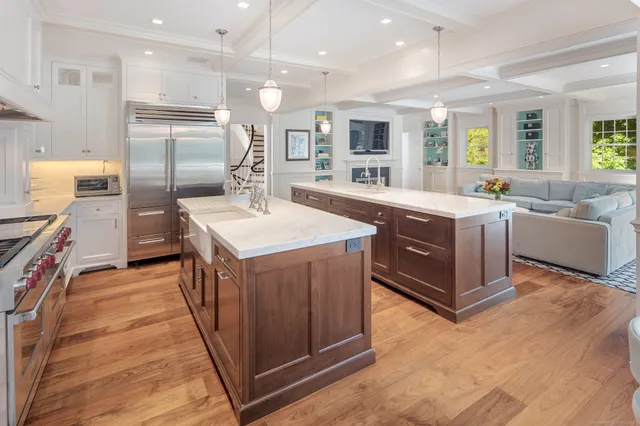 a kitchen with stainless steel appliances granite countertop a stove and a refrigerator